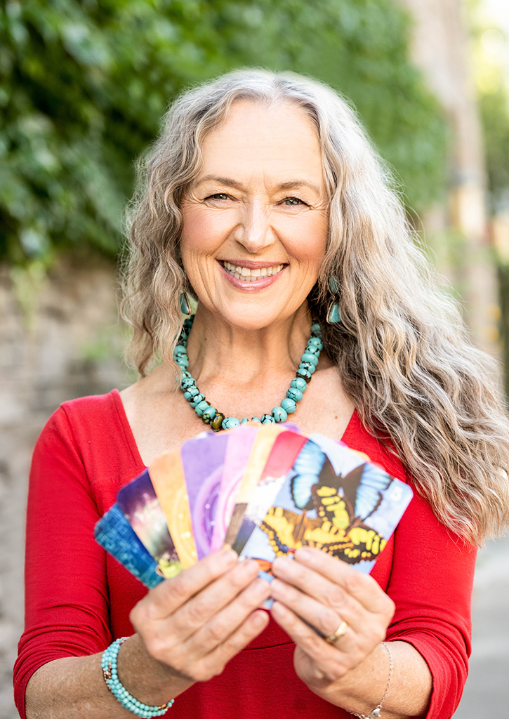 older woman holding cards