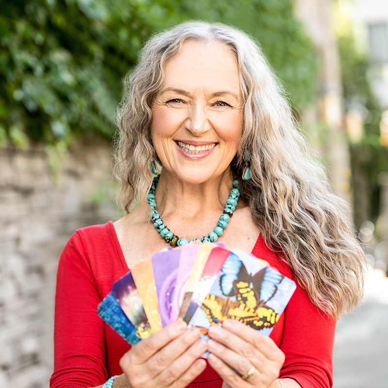 woman smiling holding cards