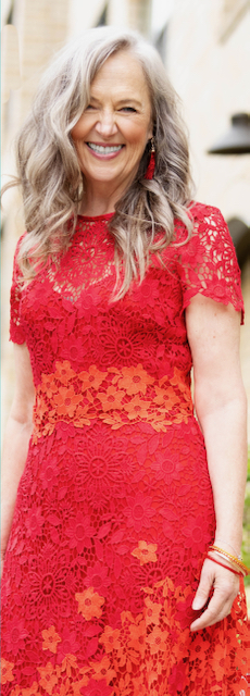 A white lady wearing red dress